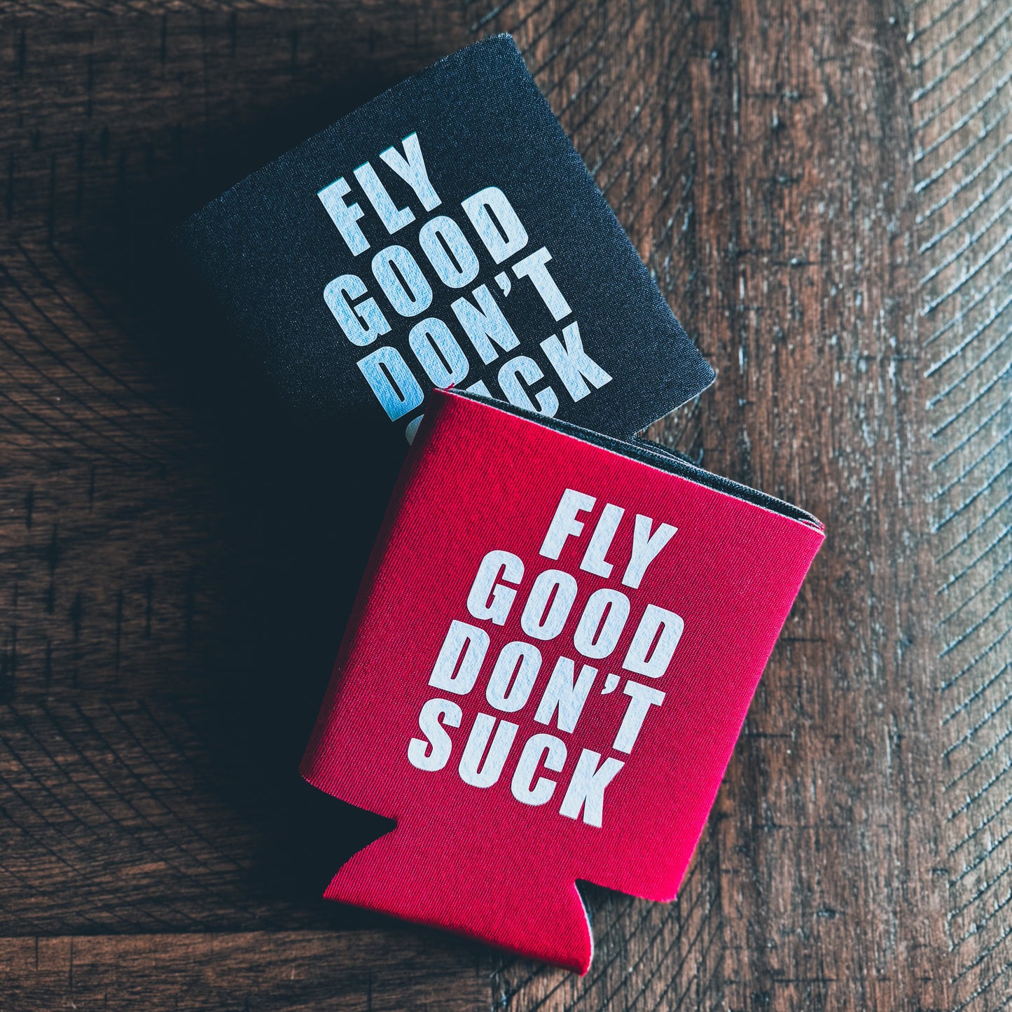 Black "Fly Good Don’t Suck" Koozie